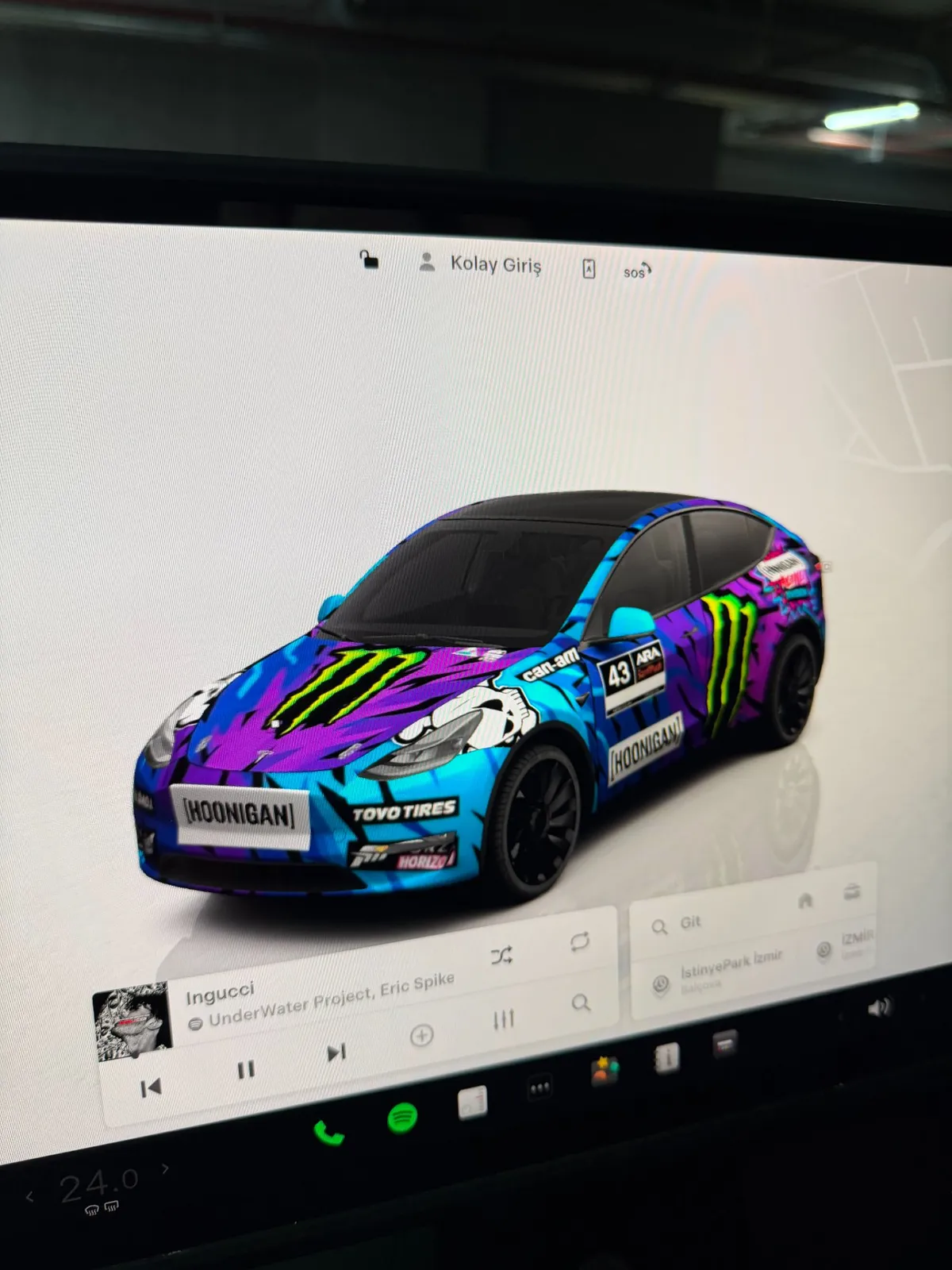 Tesla Model Y screen with custom Hoonigan wrap design - close-up
